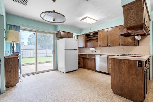 200 Hillcrest Ct, Irving, TX 75062 - kitchen featuring white appliances, open shelves, light countertops, and extractor fan