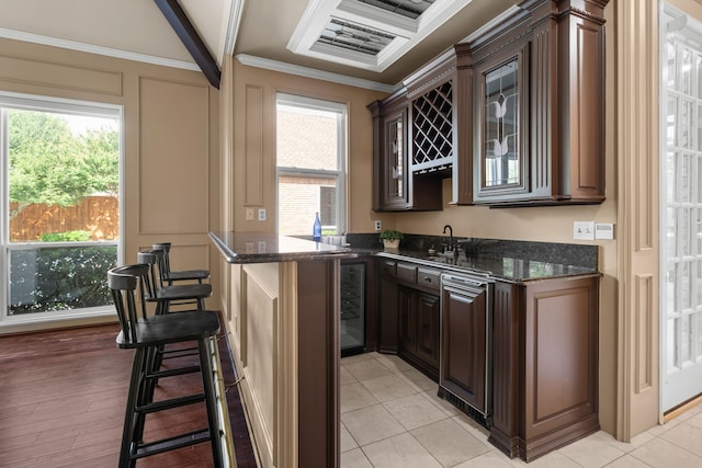4609 Huffman Ct, Plano, TX 75093 - indoor wet bar featuring ornamental molding, wine cooler, and beam ceiling