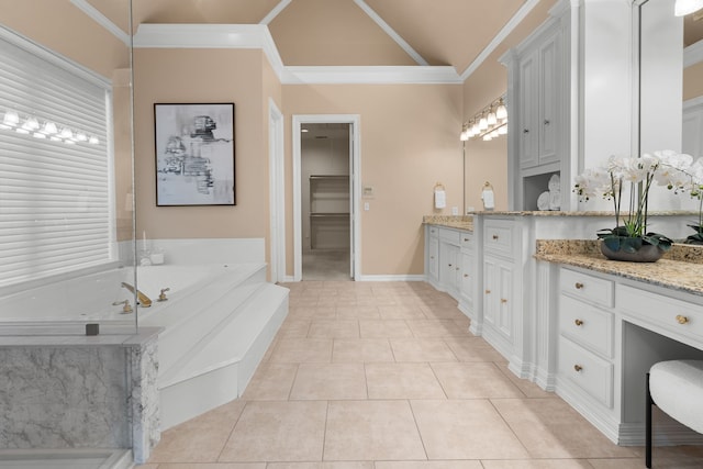 4609 Huffman Ct, Plano, TX 75093 - bathroom with vanity, a bath, ornamental molding, tile patterned floors, and vaulted ceiling