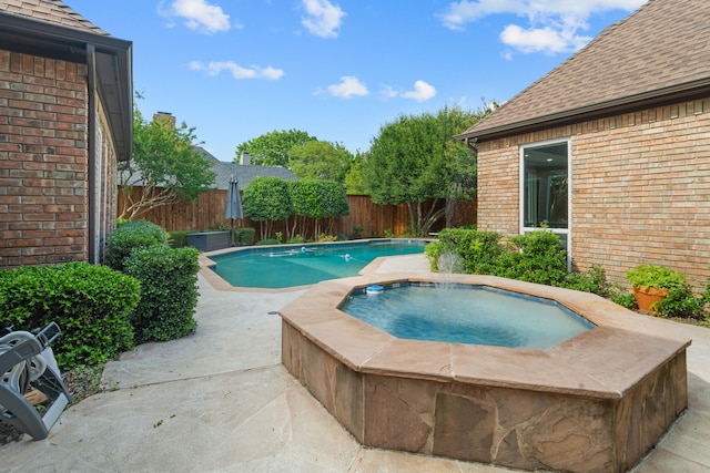 4609 Huffman Ct, Plano, TX 75093 - view of pool with an in-ground hot tub, a fenced backyard, and a patio area