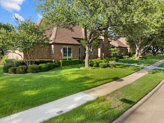 4609 Huffman Ct, Plano, TX 75093 - english style home with a front lawn and brick siding
