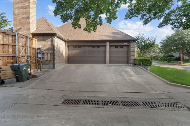 4609 Huffman Ct, Plano, TX 75093 - view of front of house with brick siding, an attached garage, concrete driveway, and a chimney