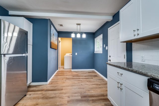 2523 Helmet St, Irving, TX 75060 - kitchen featuring stainless steel appliances, washer / clothes dryer, light wood-type flooring, backsplash, and white cabinetry