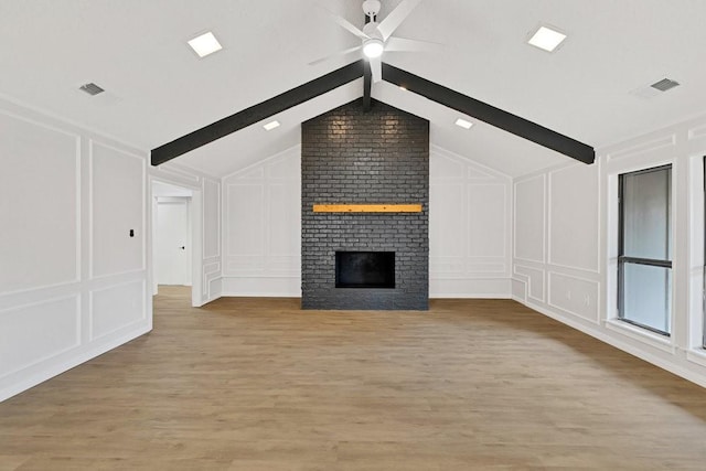 4103 Steeplewood Ct, Arlington, TX 76016 - unfurnished living room featuring a decorative wall, a ceiling fan, light wood finished floors, and a brick fireplace