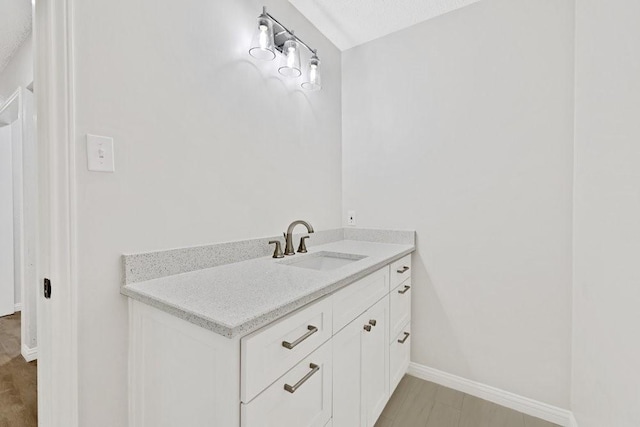 4103 Steeplewood Ct, Arlington, TX 76016 - bathroom featuring baseboards and vanity