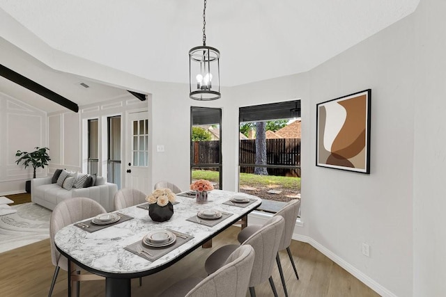 4103 Steeplewood Ct, Arlington, TX 76016 - dining space with light wood-style floors, vaulted ceiling, and baseboards