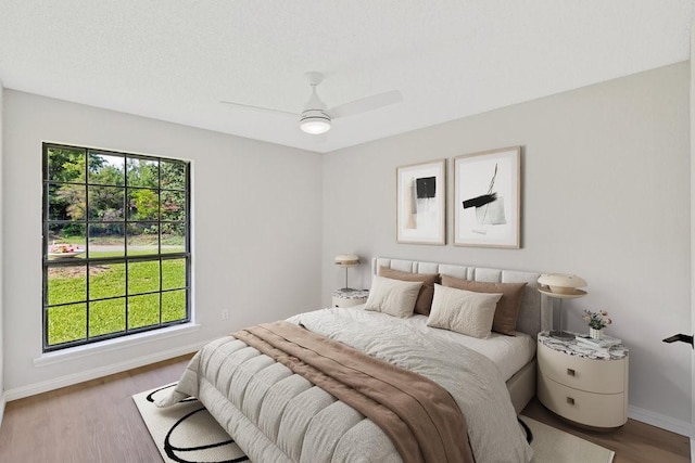 4103 Steeplewood Ct, Arlington, TX 76016 - bedroom featuring baseboards, wood finished floors, and ceiling fan