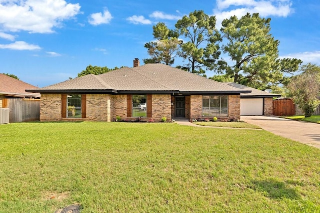 4103 Steeplewood Ct, Arlington, TX 76016 - single story home with concrete driveway, an attached garage, brick siding, a chimney, and roof with shingles