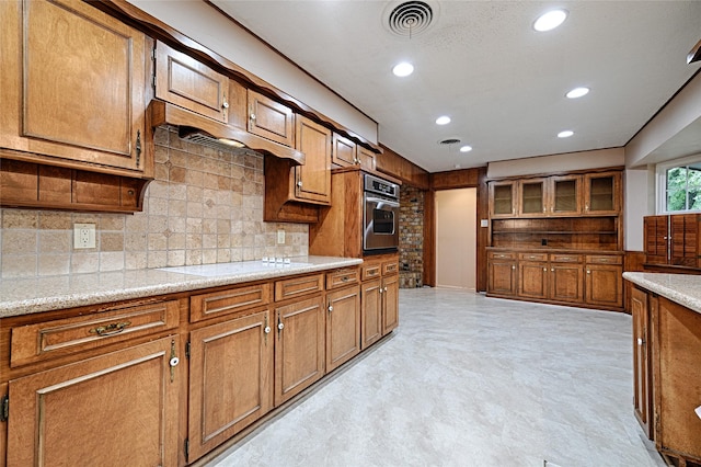 1013 Mountain Ter, Hurst, TX 76053 - kitchen featuring oven, brown cabinetry, white cooktop, backsplash, and recessed lighting