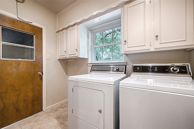 1013 Mountain Ter, Hurst, TX 76053 - laundry room with cabinet space, washing machine and dryer, and light tile patterned flooring