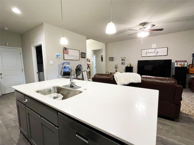 4107 Reese Ln, Krum, TX 76249 - kitchen featuring open floor plan, a kitchen island with sink, light countertops, a ceiling fan, and dishwasher