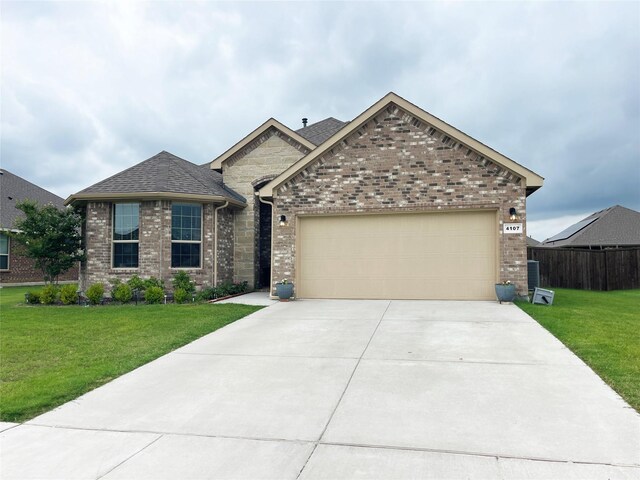 4107 Reese Ln, Krum, TX 76249 - view of front of house featuring driveway, an attached garage, brick siding, and a shingled roof