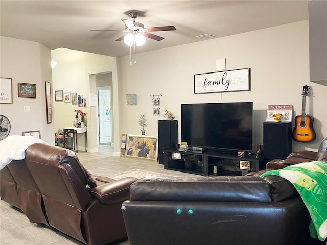 4107 Reese Ln, Krum, TX 76249 - living area with ceiling fan and light wood finished floors