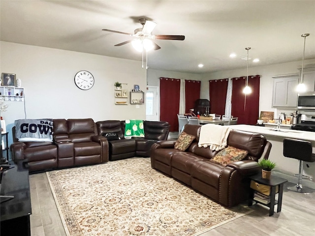 4107 Reese Ln, Krum, TX 76249 - living room with light wood finished floors, ceiling fan, and recessed lighting
