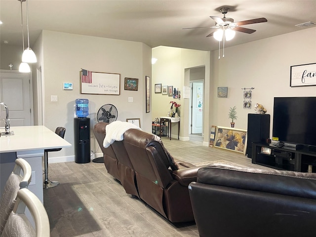 4107 Reese Ln, Krum, TX 76249 - living area featuring a ceiling fan and light wood-type flooring