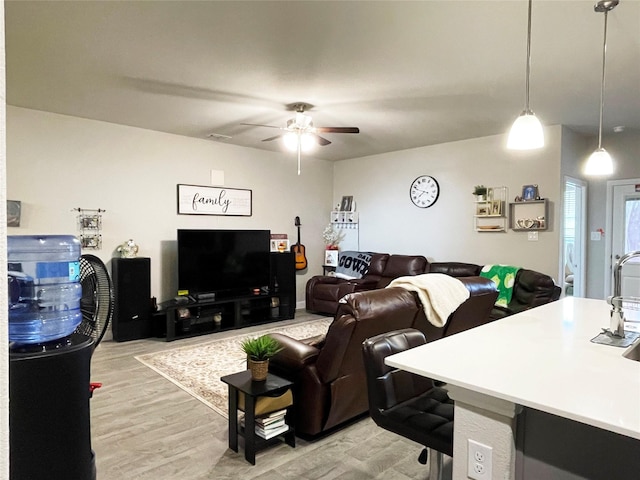 4107 Reese Ln, Krum, TX 76249 - living area with light wood-style floors and ceiling fan