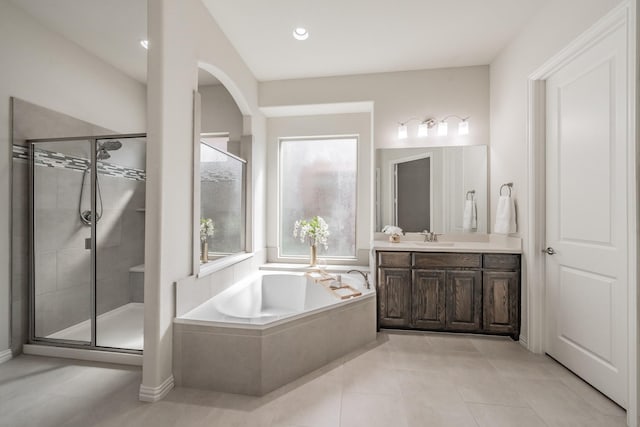 6340 Crossvine Trl, Flower Mound, TX 76226 - bathroom featuring a bath, vanity, a shower stall, and tile patterned floors