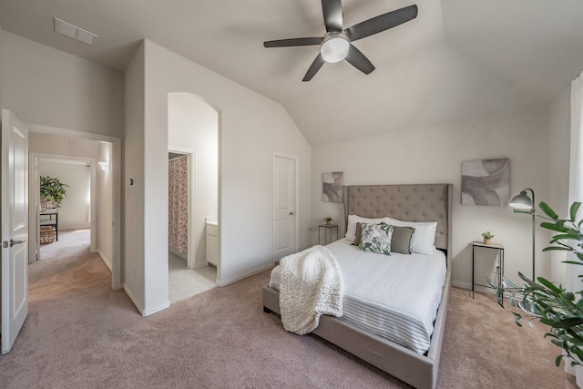 6340 Crossvine Trl, Flower Mound, TX 76226 - bedroom featuring light carpet, arched walkways, lofted ceiling, a ceiling fan, and connected bathroom