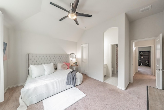 6340 Crossvine Trl, Flower Mound, TX 76226 - carpeted bedroom with arched walkways, vaulted ceiling, ensuite bath, and ceiling fan