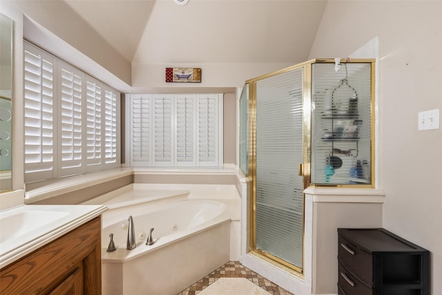 3001 Coventry Ln, Waxahachie, TX 75165 - bathroom with lofted ceiling, a shower stall, a jetted tub, vanity, and tile patterned floors