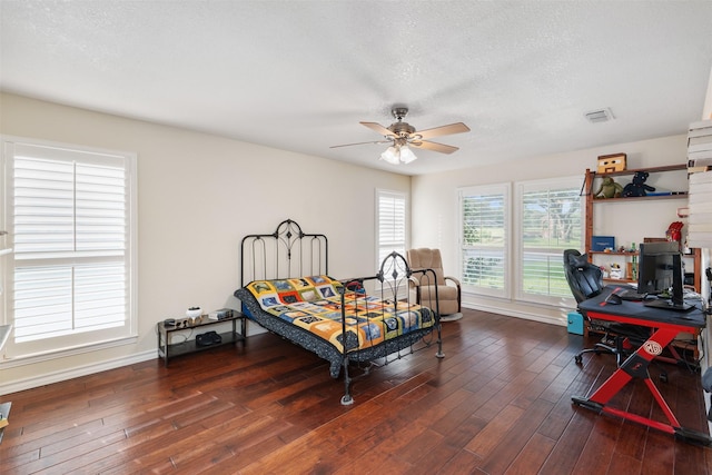 11721 Pine Creek Ct, Fort Worth, TX 76008 - bedroom with hardwood / wood-style flooring, an office area, a textured ceiling, and a ceiling fan