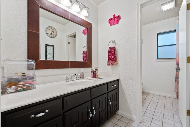 11721 Pine Creek Ct, Fort Worth, TX 76008 - bathroom featuring crown molding, vanity, tile patterned floors, and a textured wall