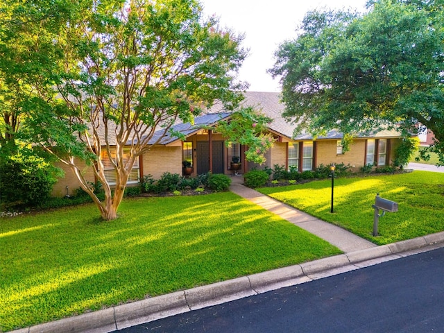 11721 Pine Creek Ct, Fort Worth, TX 76008 - view of front facade featuring a front lawn and brick siding