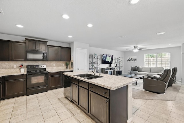 210 Hackney St, Waxahachie, TX 75165 - kitchen with black appliances, light countertops, light tile patterned flooring, tasteful backsplash, and recessed lighting