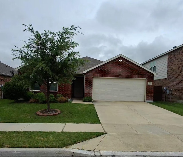 3116 Montserrat Creek Dr, Little Elm, TX 75068 - view of front of home with an attached garage, a front lawn, brick siding, and concrete driveway