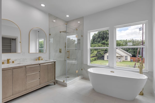 3709 Colonial Ave, Dallas, TX 75215 - full bath featuring a freestanding bath, a marble finish shower, double vanity, recessed lighting, and tile patterned floors