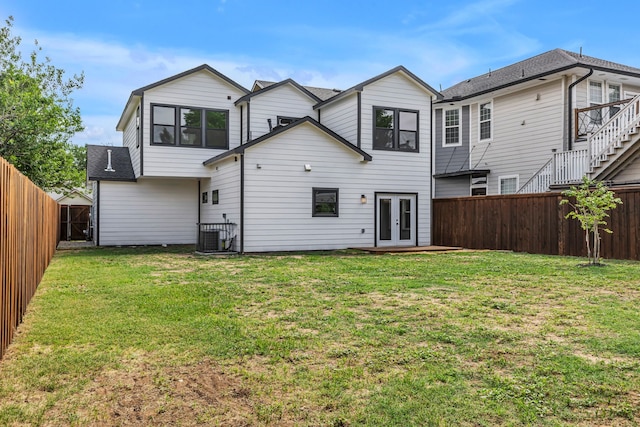 3709 Colonial Ave, Dallas, TX 75215 - back of house with french doors, a fenced backyard, and a shingled roof