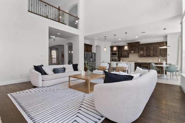 2706 Trophy Club Dr, Trophy Club, TX 76262 - living area with arched walkways, dark wood-style flooring, and recessed lighting