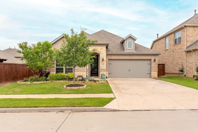 1409 Wolfberry Ln, Northlake, TX 76226 - view of front facade with an attached garage, brick siding, concrete driveway, a shingled roof, and stone siding