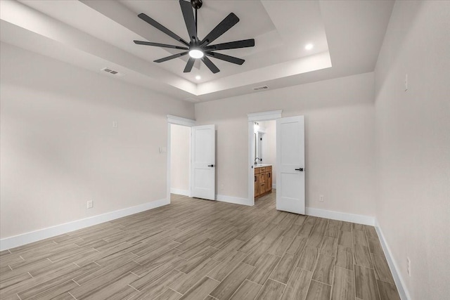 5822 Diaz Ave, Fort Worth, TX 76107 - empty room with a raised ceiling, ceiling fan, light wood-type flooring, and recessed lighting