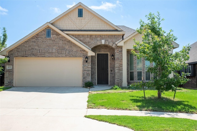 4333 Old Timber Ln, Fort Worth, TX 76036 - craftsman house featuring a front yard, driveway, an attached garage, and brick siding