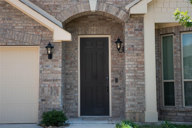 4333 Old Timber Ln, Fort Worth, TX 76036 - doorway to property featuring brick siding and a garage