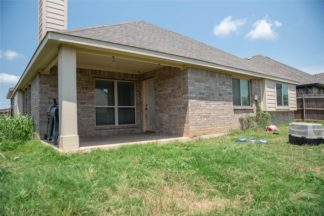4333 Old Timber Ln, Fort Worth, TX 76036 - back of house with a chimney, a patio area, brick siding, and roof with shingles