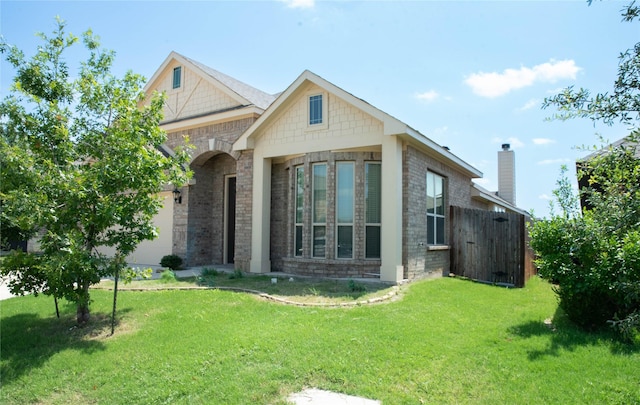4333 Old Timber Ln, Fort Worth, TX 76036 - view of front of house with a front yard, brick siding, and an attached garage