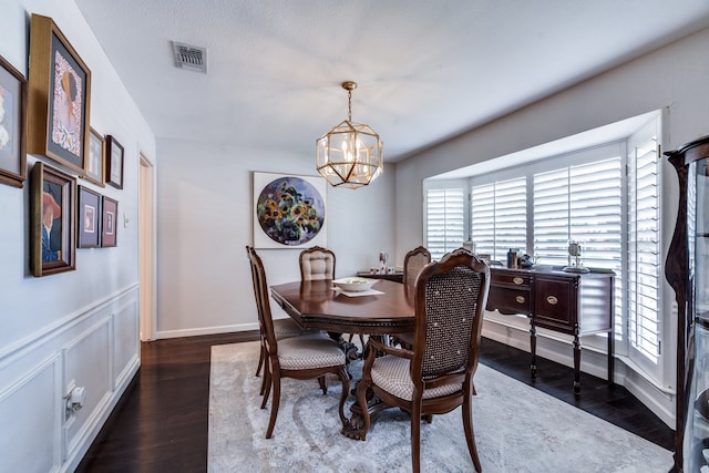 2313 Parkhaven Dr, Plano, TX 75075 - dining area featuring a chandelier, healthy amount of natural light, and dark wood-type flooring