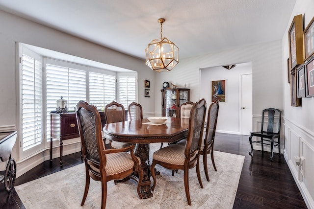2313 Parkhaven Dr, Plano, TX 75075 - dining area featuring a chandelier and dark wood-style flooring