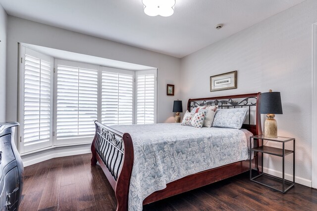 2313 Parkhaven Dr, Plano, TX 75075 - bedroom with multiple windows and wood finished floors