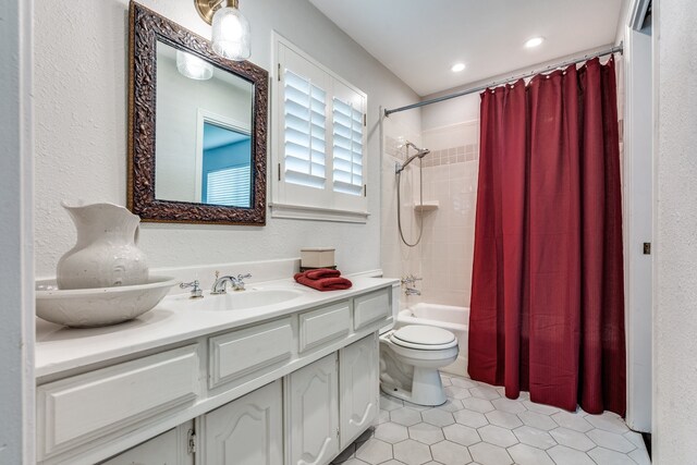 2313 Parkhaven Dr, Plano, TX 75075 - bathroom featuring vanity, shower / bath combo, tile patterned floors, and recessed lighting