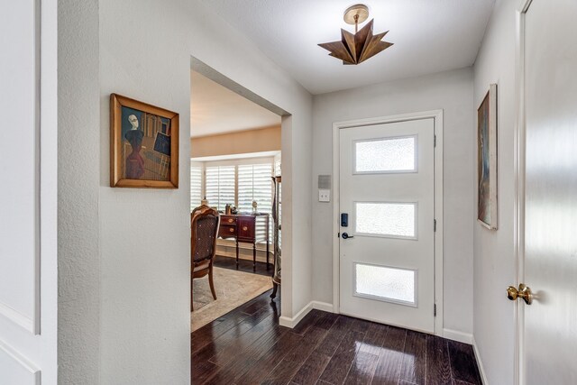 2313 Parkhaven Dr, Plano, TX 75075 - entryway with dark wood-style flooring and baseboards