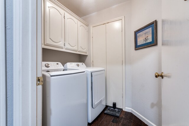 2313 Parkhaven Dr, Plano, TX 75075 - laundry room with dark wood-type flooring, washing machine and clothes dryer, and cabinet space
