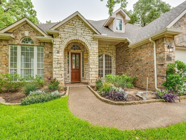 564 Austin Ct, Coppell, TX 75019 - traditional-style home featuring a garage, stone siding, concrete driveway, and roof with shingles