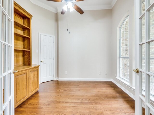 564 Austin Ct, Coppell, TX 75019 - unfurnished office with arched walkways, french doors, wood finished floors, ornamental molding, and a ceiling fan