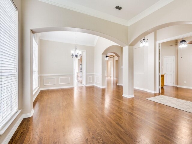 564 Austin Ct, Coppell, TX 75019 - empty room with light wood-style flooring, crown molding, a ceiling fan, and french doors
