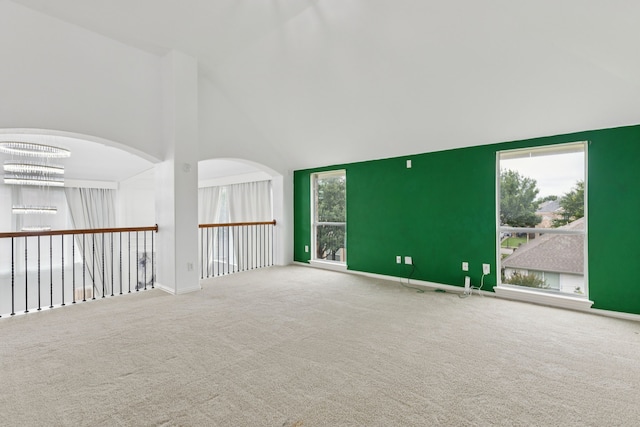 5312 Ridgeson Dr, Mckinney, TX 75071 - carpeted empty room with high vaulted ceiling and a chandelier