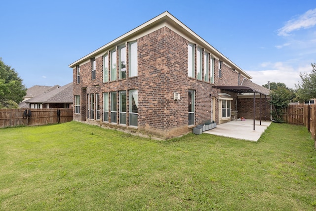 5312 Ridgeson Dr, Mckinney, TX 75071 - rear view of property featuring a patio area, brick siding, and a fenced backyard