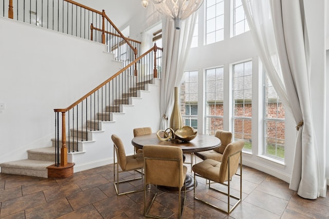 5312 Ridgeson Dr, Mckinney, TX 75071 - dining area featuring stairs and a towering ceiling